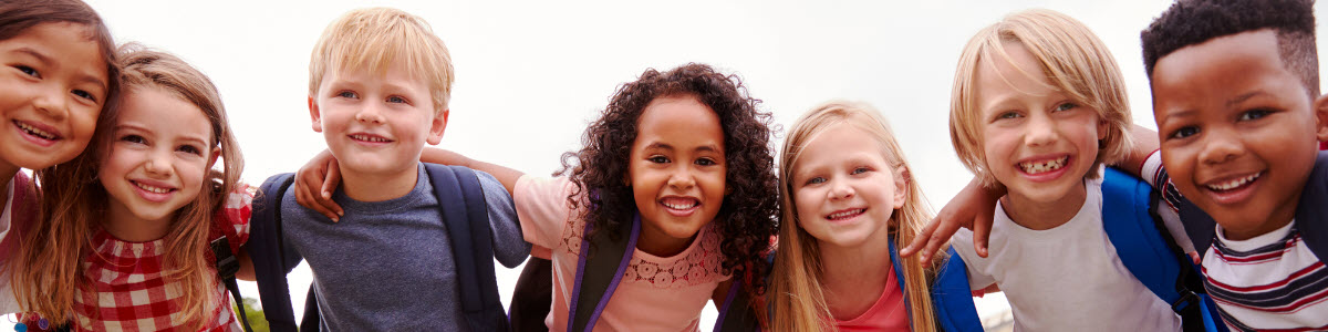Group of children with arms around each other